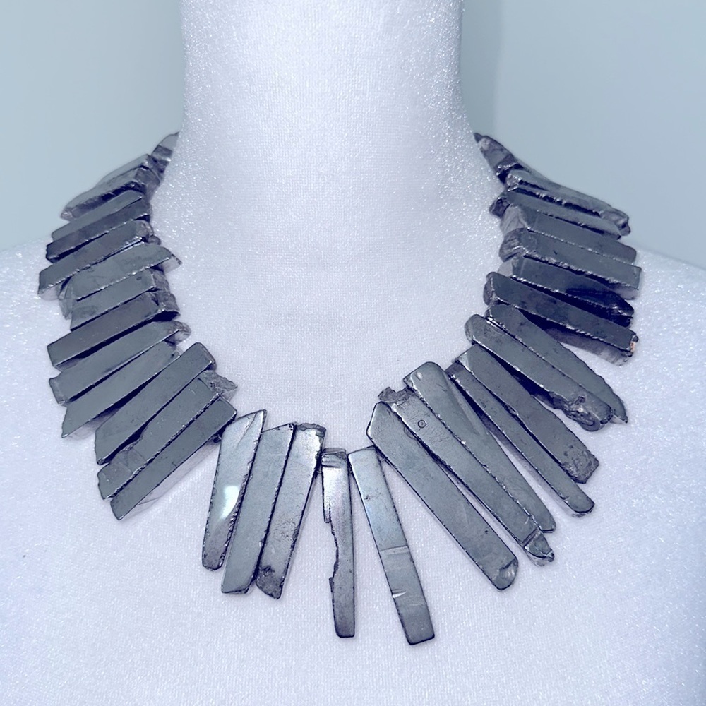 Steel colored vertical stone beads circle into a 18” choker.